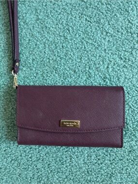 NWOT kate spade plum wristlet clutch with gold plaque. FREE SHIP